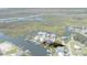 Aerial view of waterfront house with private dock on a green lot outlined in red at 5234 Foxhall Ct, Weeki Wachee, FL 34607