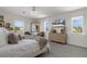 Bright primary bedroom featuring lots of natural light, wood floors, and stylish decor at 5234 Foxhall Ct, Weeki Wachee, FL 34607
