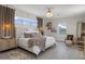Cozy bedroom featuring wood floors, lots of natural light and decorative light fixture at 5234 Foxhall Ct, Weeki Wachee, FL 34607