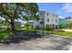 Exterior view featuring a fenced yard, a multi car garage, and well-maintained landscaping at 5234 Foxhall Ct, Weeki Wachee, FL 34607
