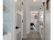 Hallway with modern touches, including decorative tilework, stylish doors, and attractive lighting at 5234 Foxhall Ct, Weeki Wachee, FL 34607