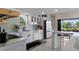 Well-lit kitchen with updated features, sleek countertops, and eat-in breakfast bar for casual dining at 5234 Foxhall Ct, Weeki Wachee, FL 34607