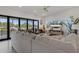 Bright living room with sliding glass doors opening to waterfront views, perfect for relaxation at 5234 Foxhall Ct, Weeki Wachee, FL 34607