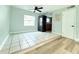 View of a laundry area in the living room with tile flooring and a stacked washer and dryer at 5713 Townhouse Dr # 5713, New Port Richey, FL 34652