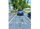 Reserved parking spot in a community near charming homes and lush trees at 5713 Townhouse Dr # 5713, New Port Richey, FL 34652