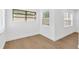 A bright bedroom with light-colored floors, two windows, and fresh white paint at 5753 2Nd N Ave, St Petersburg, FL 33710