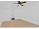 Large bright bedroom featuring a ceiling fan, light wood floors, and ensuite bathroom at 5753 2Nd N Ave, St Petersburg, FL 33710