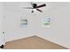 A bright bedroom with light-colored floors, two windows, and fresh white paint at 5753 2Nd N Ave, St Petersburg, FL 33710