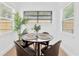 Dining area featuring a round table with seating for four and natural light at 5753 2Nd N Ave, St Petersburg, FL 33710