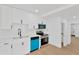 Bright kitchen features stainless steel appliances, stylish white cabinets, and countertops at 5753 2Nd N Ave, St Petersburg, FL 33710