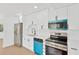 Modern kitchen features stainless steel appliances, sleek white cabinetry, and quartz countertops at 5753 2Nd N Ave, St Petersburg, FL 33710