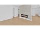 Modern living room with light wood floors and a striking stone accent wall with fireplace at 5753 2Nd N Ave, St Petersburg, FL 33710