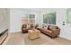 Cozy living room with two sofas, natural light, and stylish decor at 5753 2Nd N Ave, St Petersburg, FL 33710