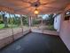 Enclosed lanai featuring screens and an open view of the lush backyard and landscape at 6339 Delaware Ave, New Port Richey, FL 34653