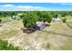 Aerial view of the home on a large lot with mature trees at 7089 Goodway, Brooksville, FL 34602