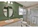 Well-lit bathroom featuring a glass enclosed shower and neutral toned tile at 7089 Goodway, Brooksville, FL 34602