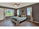 Serene bedroom with wood floors, ample natural light, and peaceful backyard views at 7089 Goodway, Brooksville, FL 34602