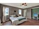 Serene bedroom with wood floors, ample natural light, and peaceful backyard views at 7089 Goodway, Brooksville, FL 34602