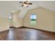 Bedroom featuring hardwood floors, ceiling fan and a large window at 7089 Goodway, Brooksville, FL 34602