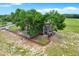 Charming home with large trees, fenced yard, and a lovely deck for outdoor enjoyment at 7089 Goodway, Brooksville, FL 34602