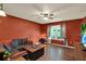 Bright living room with a cozy seating area and natural light from a large window at 7089 Goodway, Brooksville, FL 34602