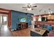 Cozy living room featuring an open floorplan, wood-look floors, and modern decor at 7089 Goodway, Brooksville, FL 34602