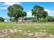 Yard with a large shed and mature trees at 7089 Goodway, Brooksville, FL 34602