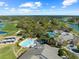 Beautiful aerial view of community amenities, including the pool, tennis courts, and golf course at 7367 Willow Brook Dr, Spring Hill, FL 34606