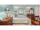 Cozy bedroom with ample natural light, neutral color palette, and bay window at 7367 Willow Brook Dr, Spring Hill, FL 34606