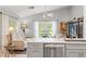 Open-concept kitchen and living area with stainless steel appliances, modern decor and great lighting at 7367 Willow Brook Dr, Spring Hill, FL 34606