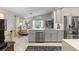 Bright open-concept kitchen and living room with stainless steel appliances and modern decor at 7367 Willow Brook Dr, Spring Hill, FL 34606
