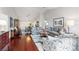 Inviting living room featuring hardwood floors and neutral decor flowing into dining room at 7367 Willow Brook Dr, Spring Hill, FL 34606