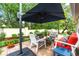 Outdoor patio area with comfortable seating and umbrella, perfect for entertaining or relaxing at 7367 Willow Brook Dr, Spring Hill, FL 34606