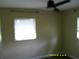 View of a bedroom featuring neutral walls, carpeted floor, and a window for natural light at 7419 E Comanche Ave, Tampa, FL 33610