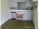 Modern kitchen features updated cabinetry, stainless steel appliances, and stylish backsplash at 7419 E Comanche Ave, Tampa, FL 33610