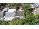 Aerial view of the home's roof and surrounding mature landscaping at 7501 Woodbox Row, Hudson, FL 34667