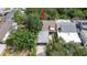 A stunning aerial view highlighting the property's roof, landscaping, and proximity to neighboring homes at 7501 Woodbox Row, Hudson, FL 34667