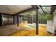 Enclosed back patio with a built-in jacuzzi offers a relaxing retreat at 7501 Woodbox Row, Hudson, FL 34667