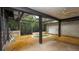 Enclosed back patio with a built-in jacuzzi offers a relaxing retreat at 7501 Woodbox Row, Hudson, FL 34667