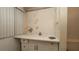 Bathroom featuring a sink, vanity, and a toilet. The room needs repairs at 7501 Woodbox Row, Hudson, FL 34667