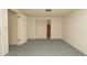 Bedroom with neutral walls, carpet, and a closet at 7501 Woodbox Row, Hudson, FL 34667
