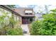 Charming home exterior with lush landscaping and a welcoming entrance at 7501 Woodbox Row, Hudson, FL 34667
