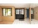 Inviting foyer with tile flooring, decorative mirror and double door entrance at 7501 Woodbox Row, Hudson, FL 34667