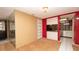 View of the living room adjacent to a kitchen and front entryway at 7501 Woodbox Row, Hudson, FL 34667