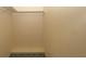 A walk-in closet with neutral walls and carpeted floor provides organized storage at 7501 Woodbox Row, Hudson, FL 34667