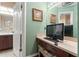 Functional bathroom space with a vanity area, good lighting, and potential for use as a dressing area or study nook at 7512 Heather Walk Dr, Weeki Wachee, FL 34613