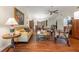 Cozy living room with hardwood floors, vaulted ceilings, neutral paint, and classic furnishings at 7512 Heather Walk Dr, Weeki Wachee, FL 34613
