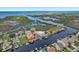 Aerial view of canal-front homes and waterway near the sea with waterfront properties at 7520 Mako Dr, Hudson, FL 34667