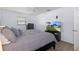 Comfortable bedroom boasts a ceiling fan, large bed and neutral colors for a relaxing atmosphere at 7520 Mako Dr, Hudson, FL 34667