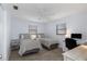 Light bedroom with two twin beds, ceiling fan and natural light creating a relaxing atmosphere at 7520 Mako Dr, Hudson, FL 34667